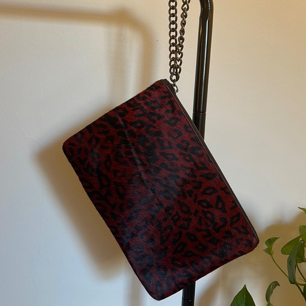Faux Cowhide cheetah print clutch with chain wristlet